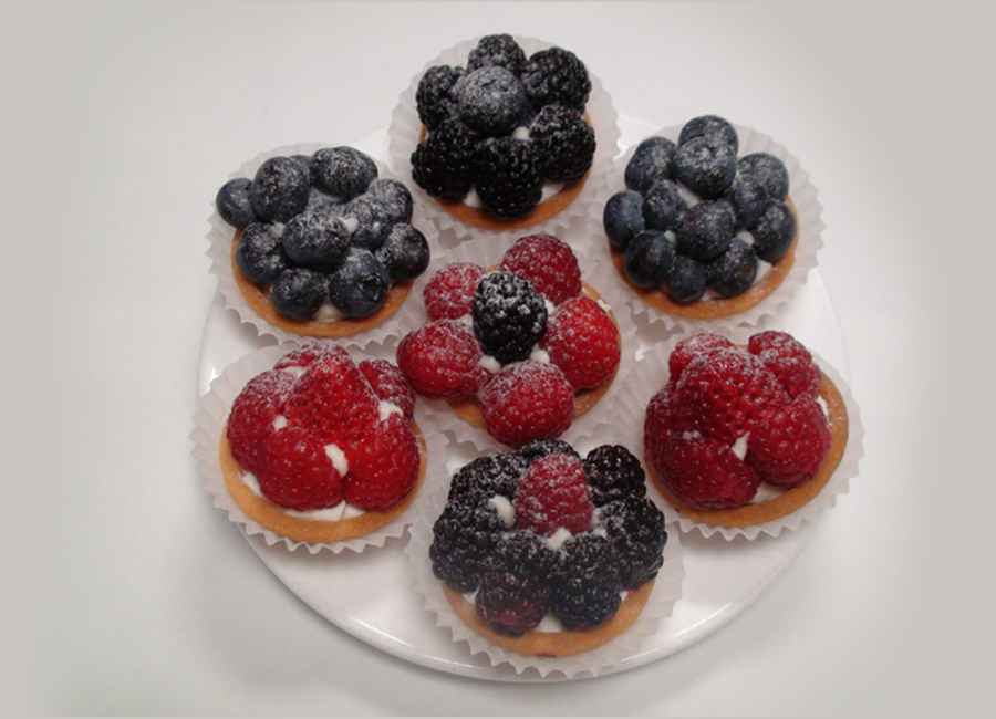 Pastries - Tarts (berry, lemon, French apple, pear almond, peach almond) at Patisserie D'Or Bakery in Oakville, Ontario.
